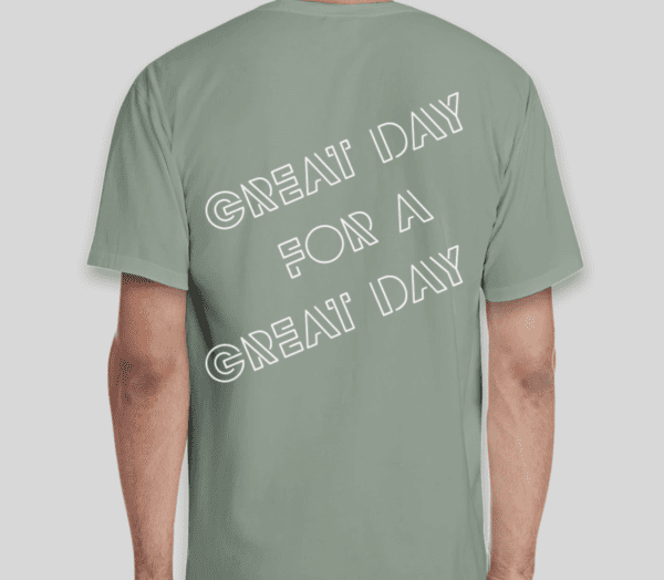 Man in a green shirt with the Great Day Tee written on the back.